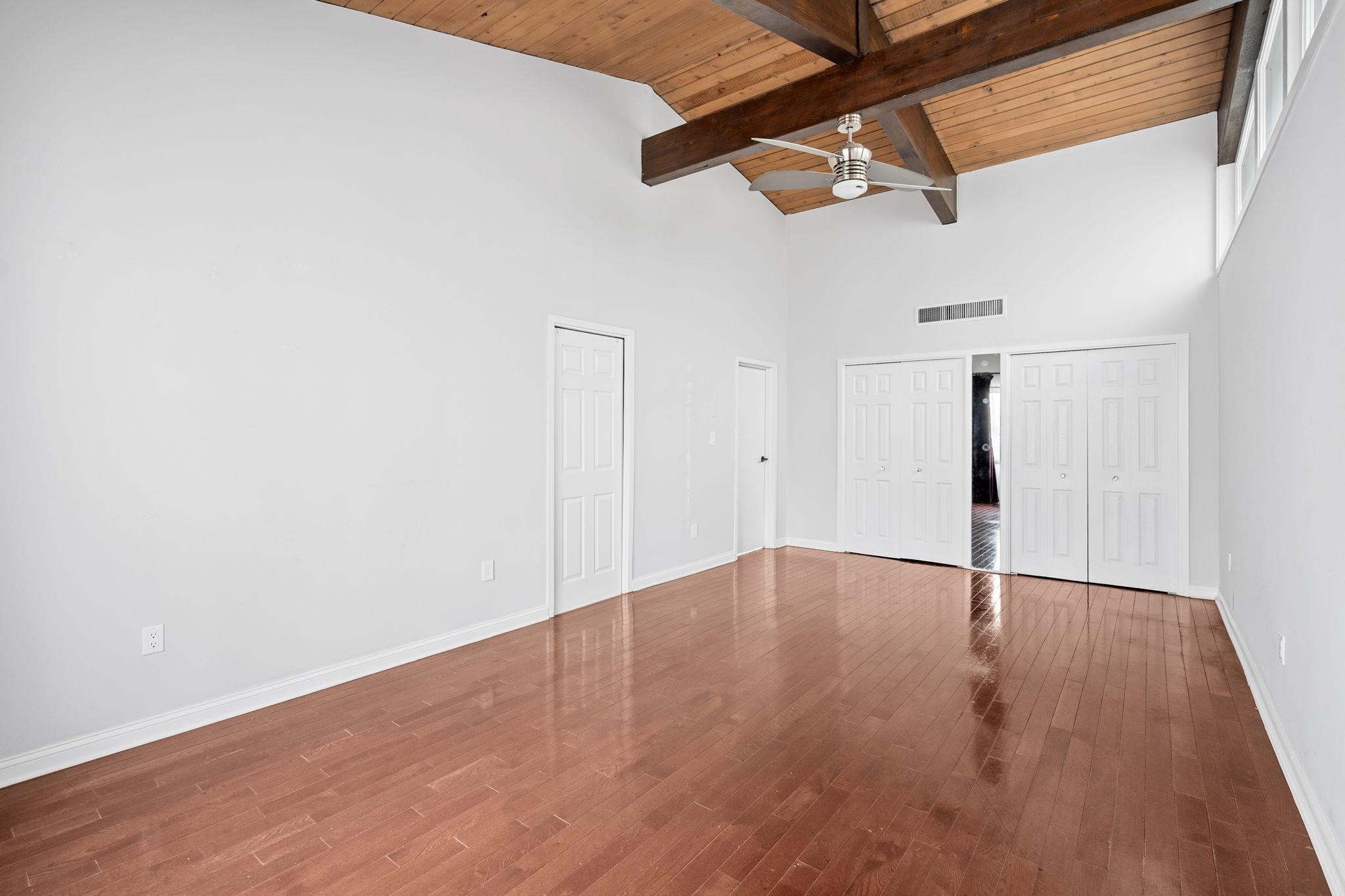 76 Hackensack Plank Road Weehawken, NJ 07086 - Photo 18 of 44 a view of an empty room with wooden floor