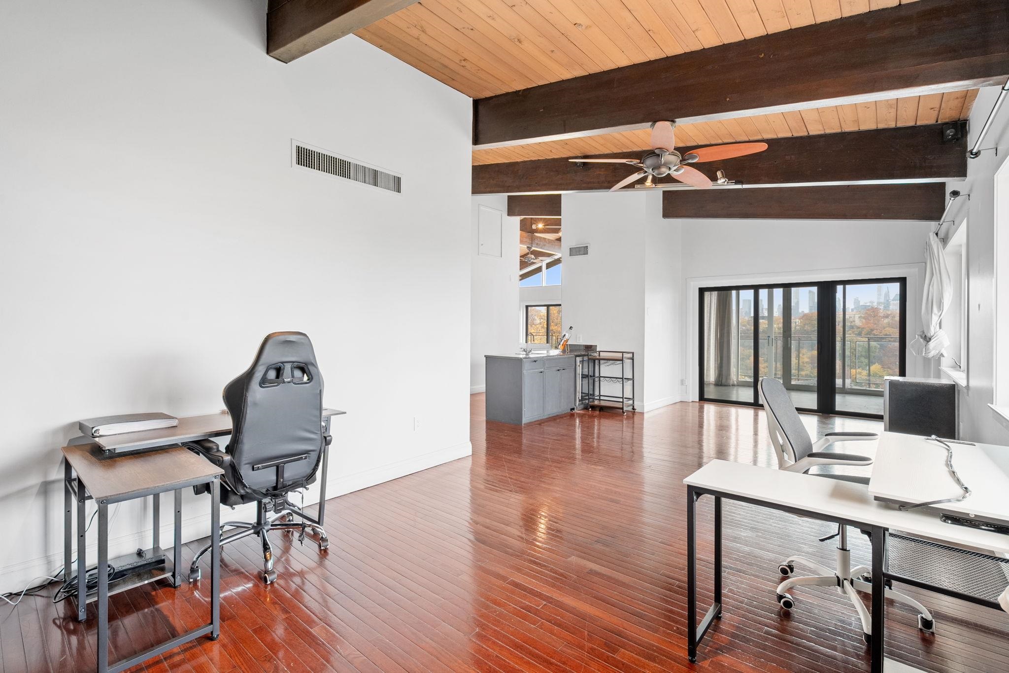 76 Hackensack Plank Road Weehawken, NJ 07086 - Photo 21 of 44 a living room with furniture and wooden floor