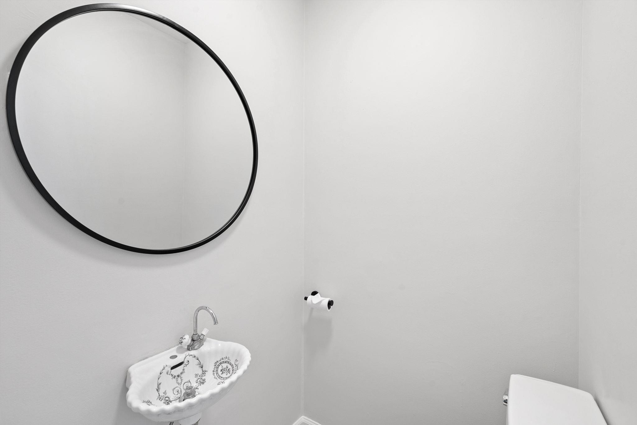 76 Hackensack Plank Road Weehawken, NJ 07086 - Photo 26 of 44 a bathroom with a sink and a mirror