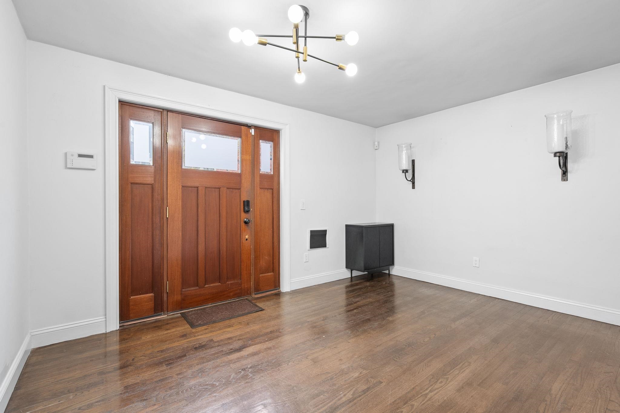 76 Hackensack Plank Road Weehawken, NJ 07086 - Photo 3 of 44 wooden floor in an empty room with a window