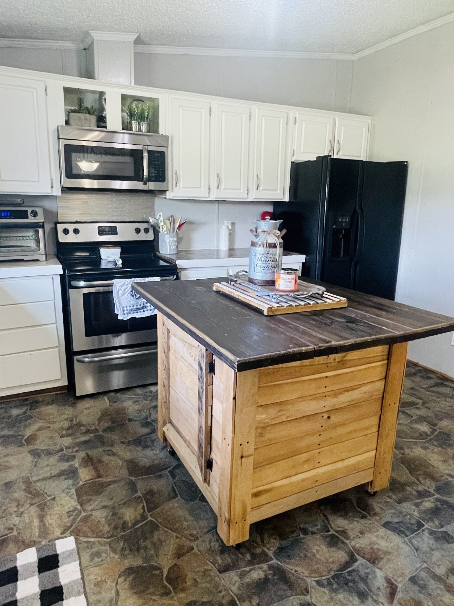 2015 Pomroy Road Manchester, TN 37355 - Photo 14 of 47 a kitchen with stainless steel appliances granite countertop a stove a refrigerator and a microwave