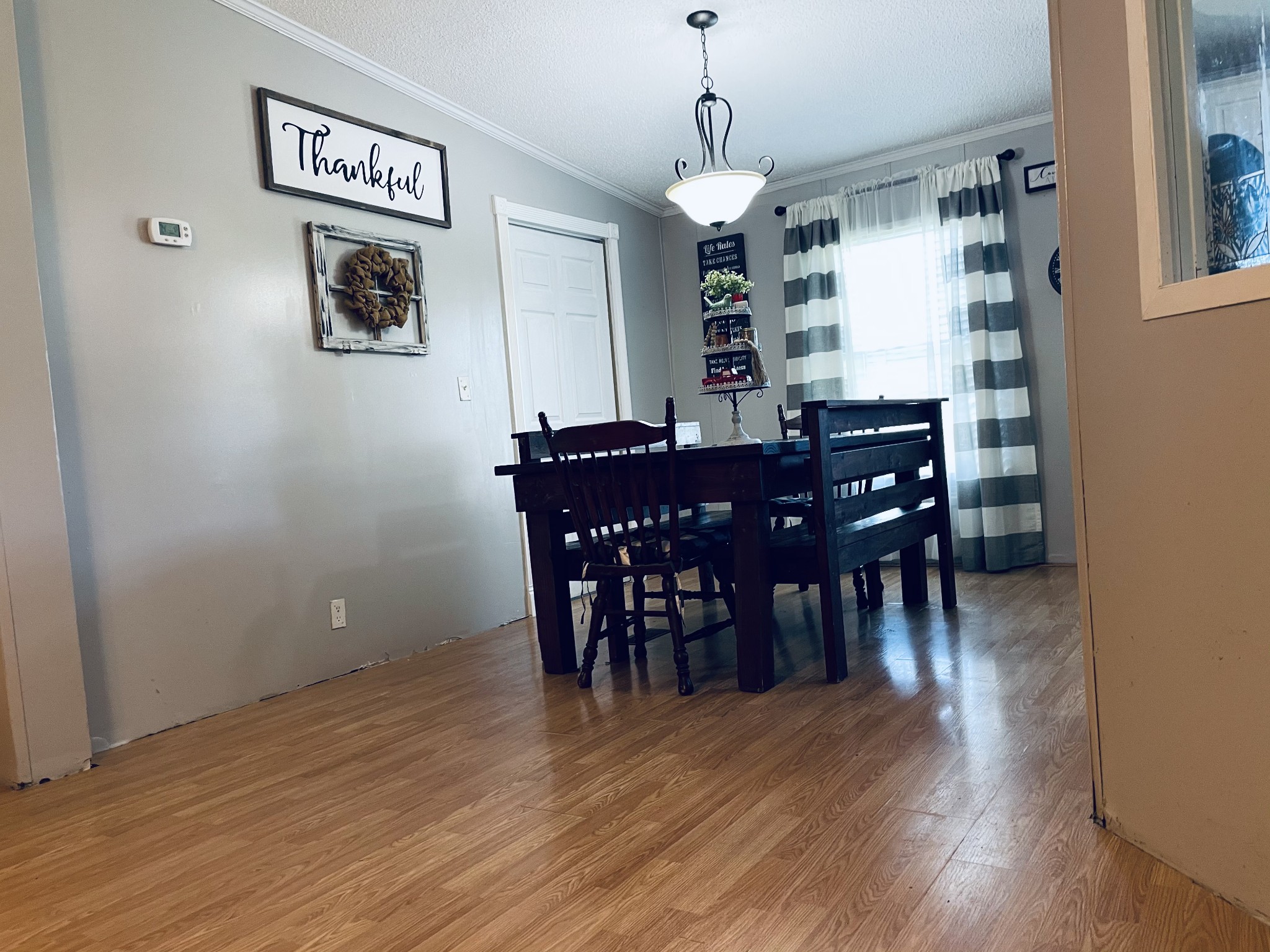 2015 Pomroy Road Manchester, TN 37355 - Photo 9 of 47 a view of a dining room with furniture and wooden floor