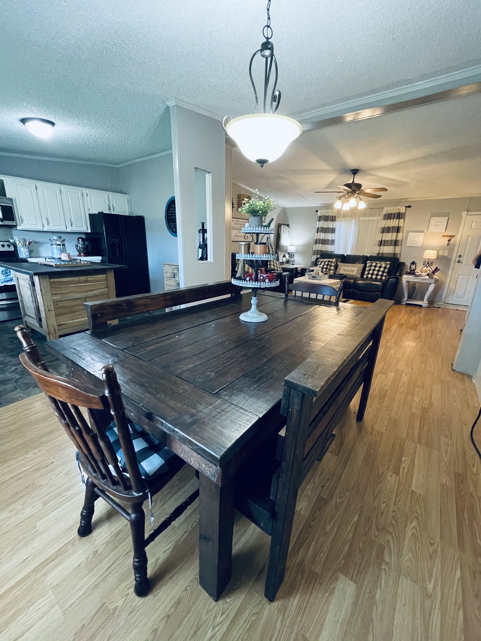 2015 Pomroy Road Manchester, TN 37355 - Photo 10 of 47 a view of a dining room with furniture a chandelier and wooden floor