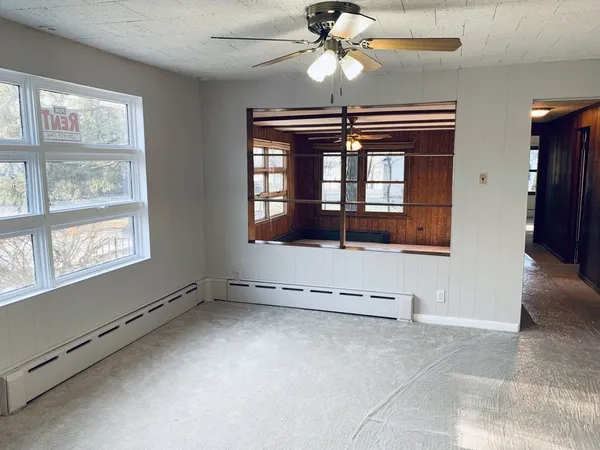 a view of an empty room with a window