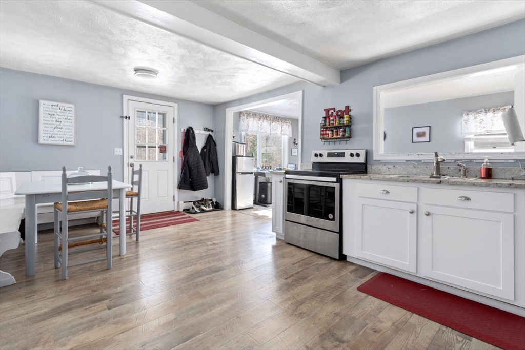 53 Rabbit Road Salisbury, MA 01952 - Photo 12 of 42 a view of a kitchen with furniture and wooden floor