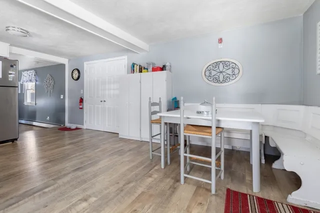 a view of a dining area with furniture and wooden floor