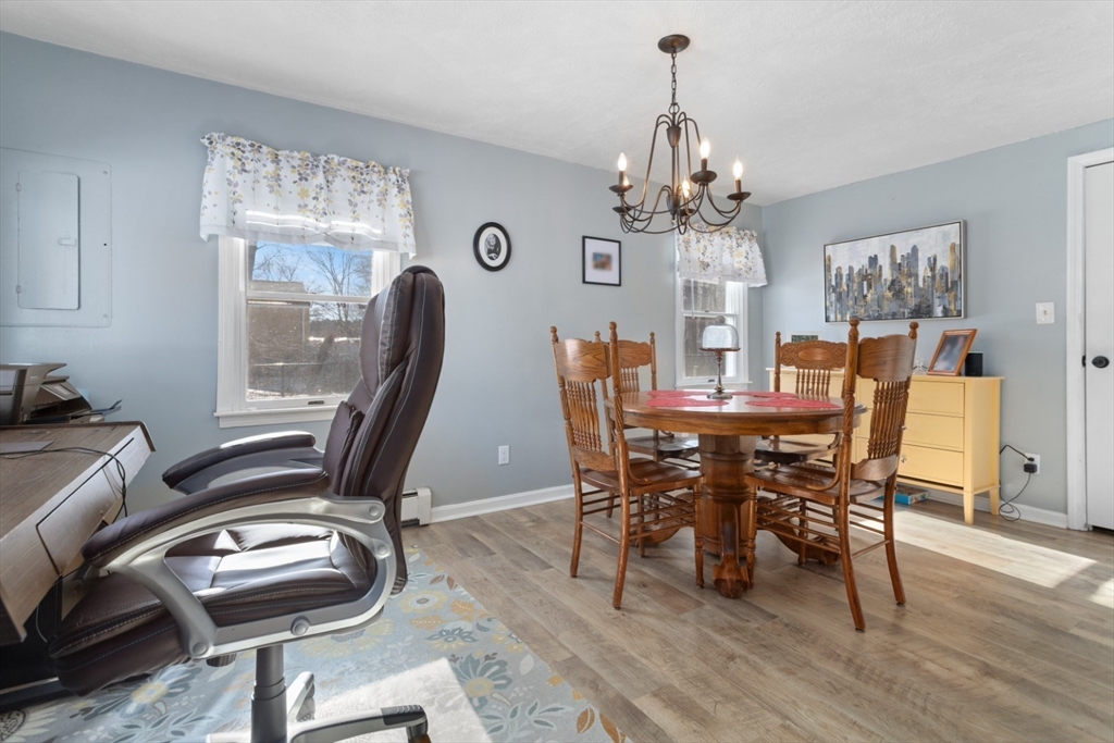 53 Rabbit Road Salisbury, MA 01952 - Photo 16 of 42 a view of a dining room with furniture and a chandelier
