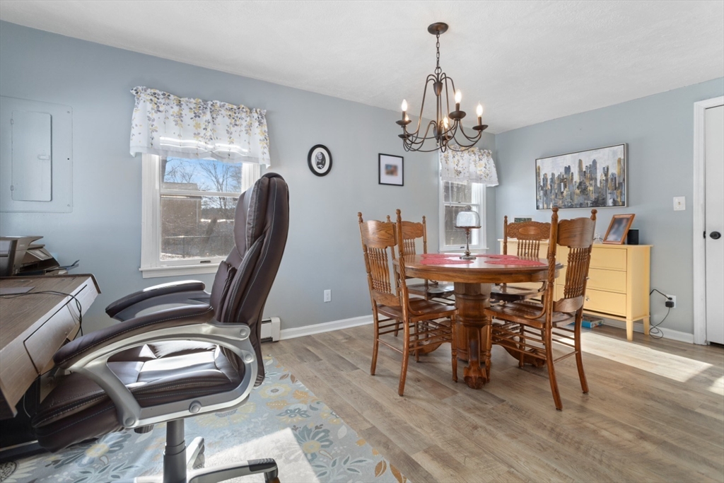 53 Rabbit Road Salisbury, MA 01952 - Photo 17 of 41 a view of a dining room with furniture and a chandelier
