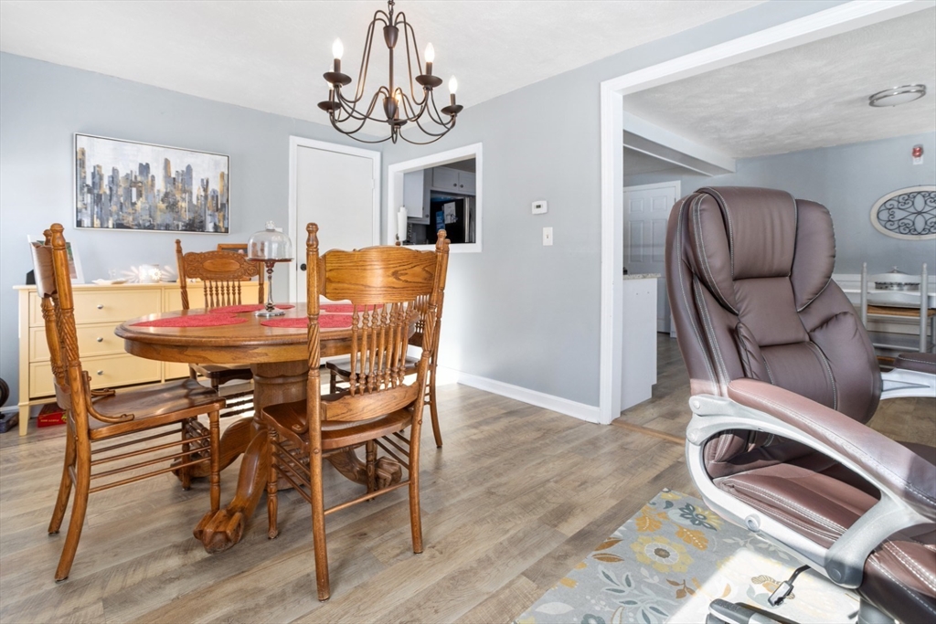 53 Rabbit Road Salisbury, MA 01952 - Photo 18 of 42 a view of a dining room with furniture and chandelier