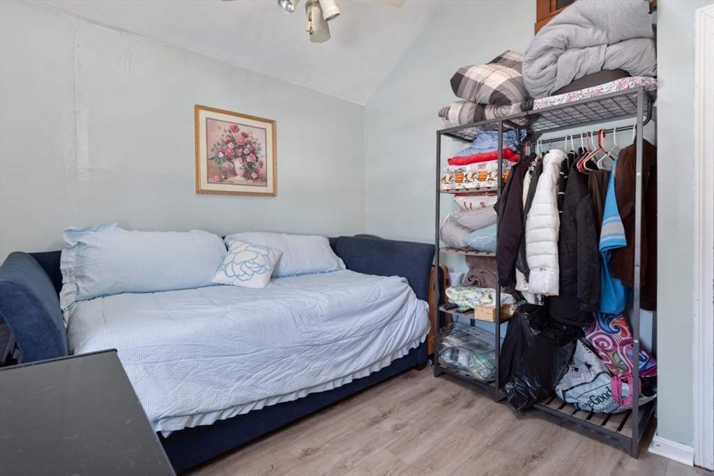 53 Rabbit Road Salisbury, MA 01952 - Photo 27 of 41 a bed room with a bed and a couch