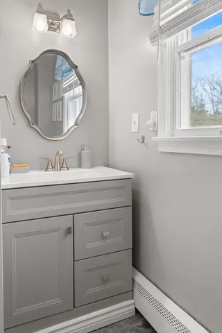 a bathroom with a sink and a mirror
