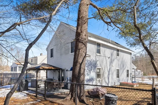 a large tree in front of a house