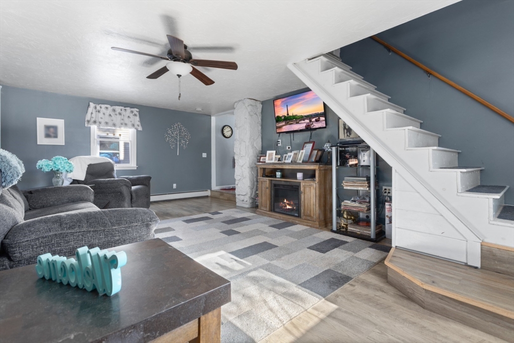 53 Rabbit Road Salisbury, MA 01952 - Photo 7 of 41 a living room with furniture and a flat screen tv