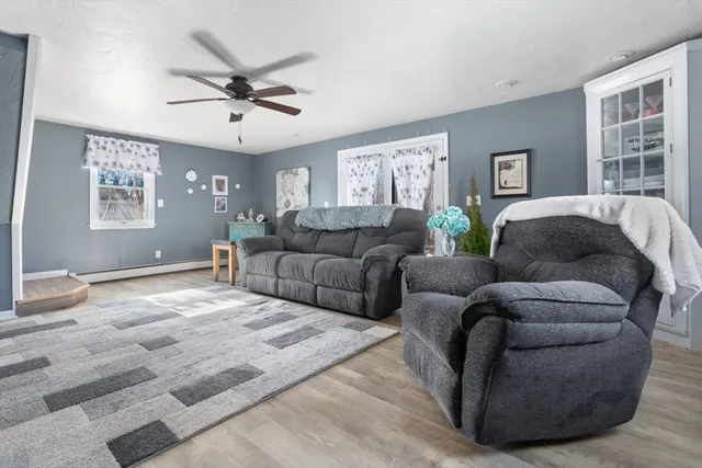 a living room with furniture and windows