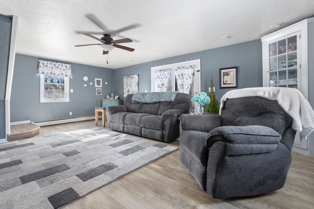 53 Rabbit Road Salisbury, MA 01952 - Photo 10 of 41 a living room with furniture and windows