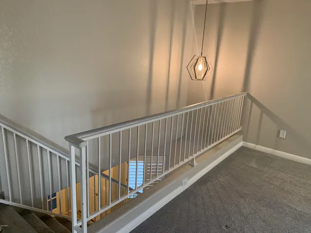 a view of a hallway with staircase