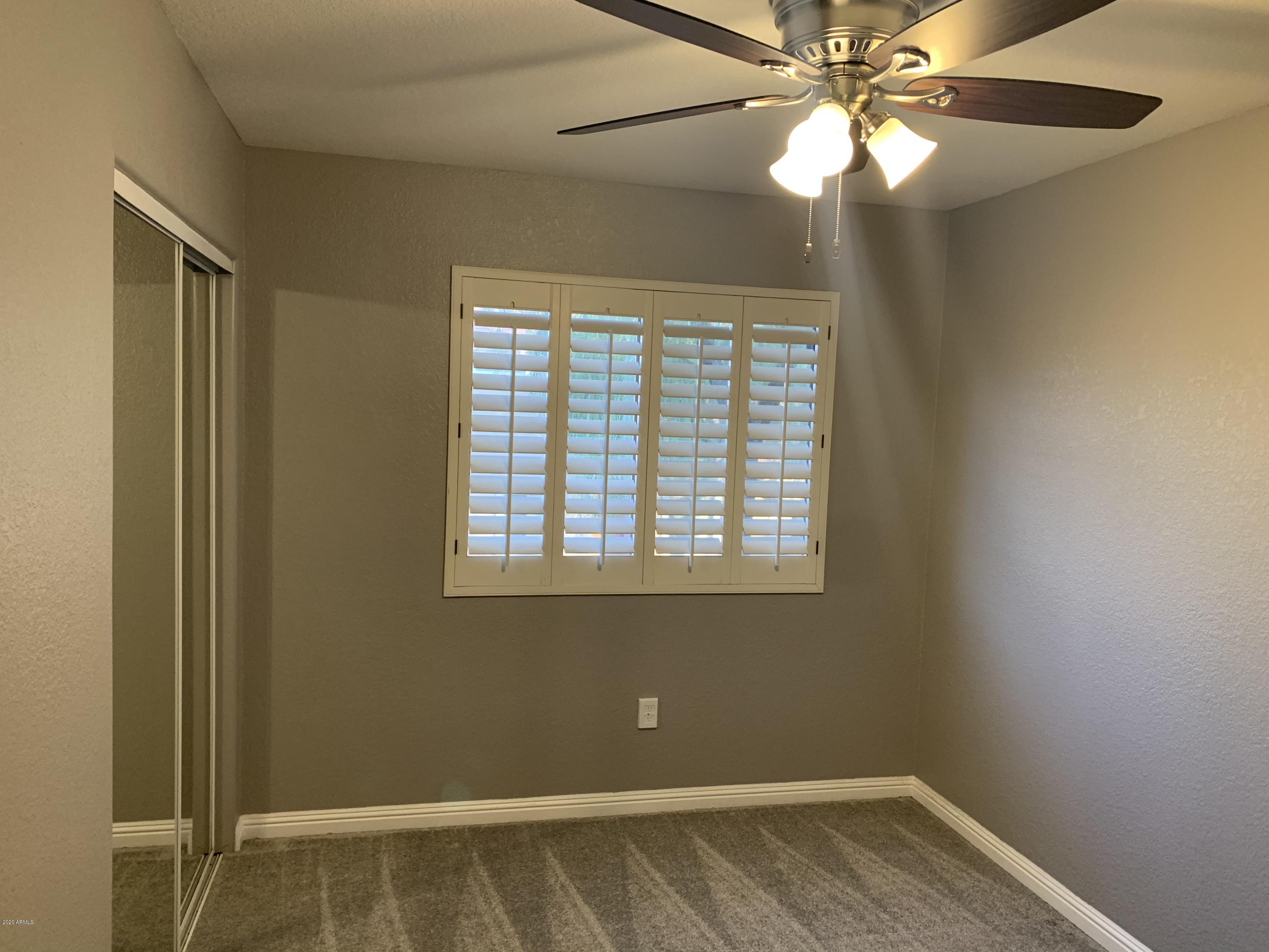 21842 North 40th Place Phoenix, AZ 85050 - Photo 21 of 42 a view of an empty room with a window