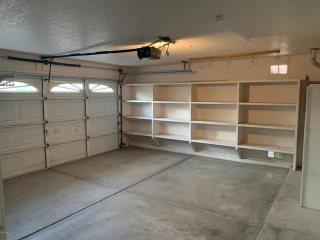 a view of a room with racks on the wall