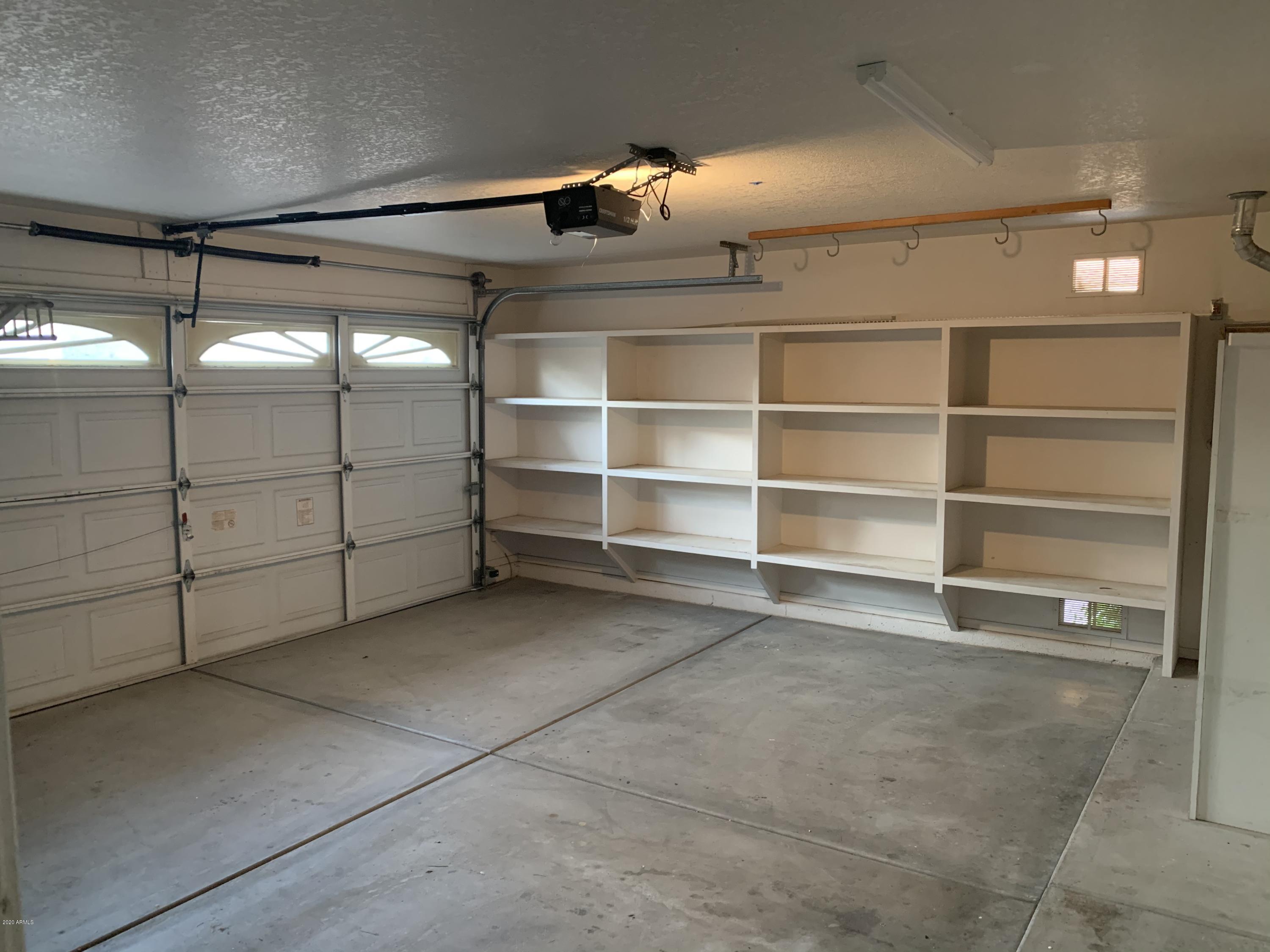 21842 North 40th Place Phoenix, AZ 85050 - Photo 30 of 42 a view of a room with racks on the wall