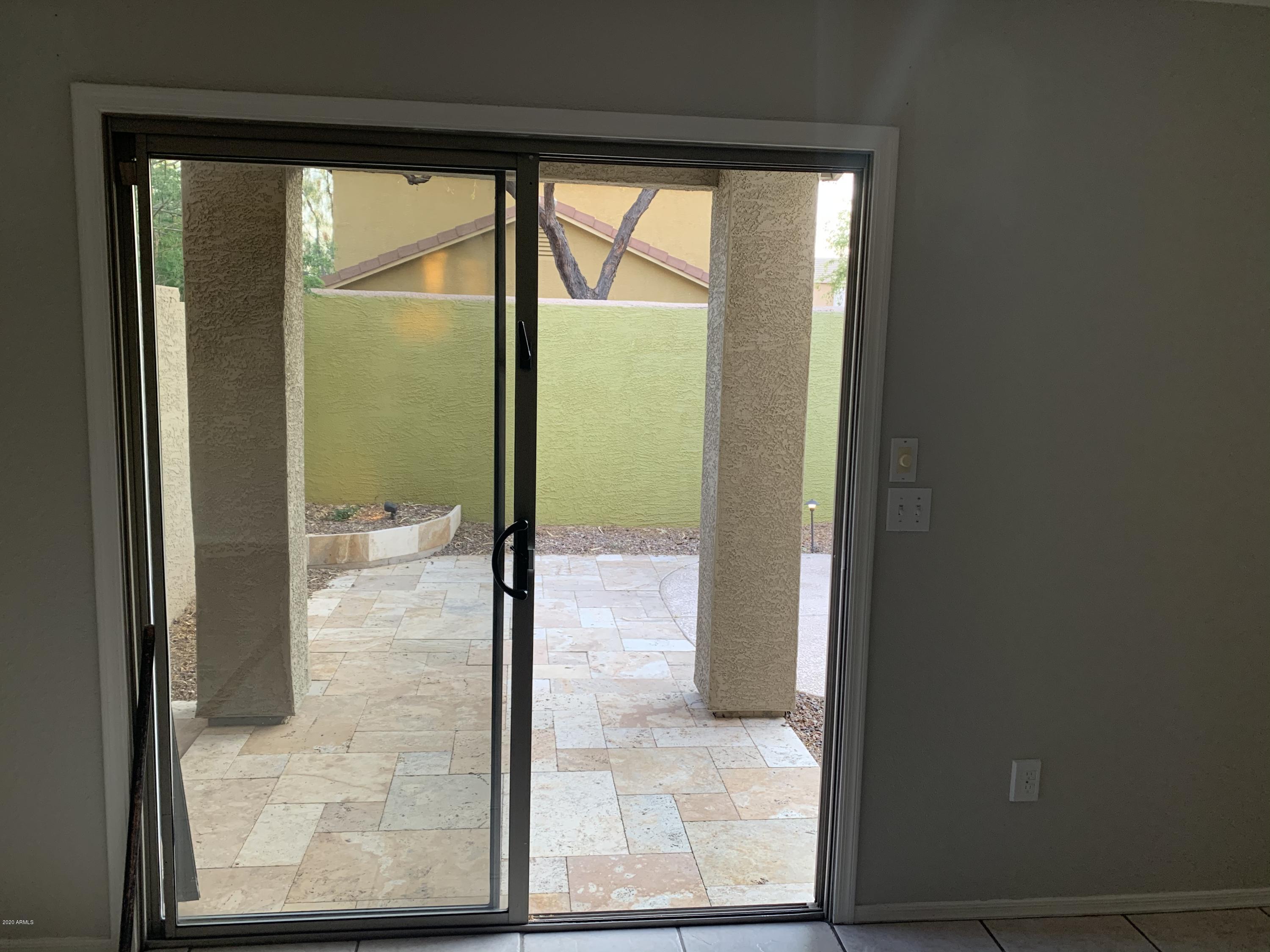 21842 North 40th Place Phoenix, AZ 85050 - Photo 31 of 42 a view of a glass door and an outdoor space