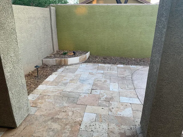 a bathroom with a granite countertop shower and a sink
