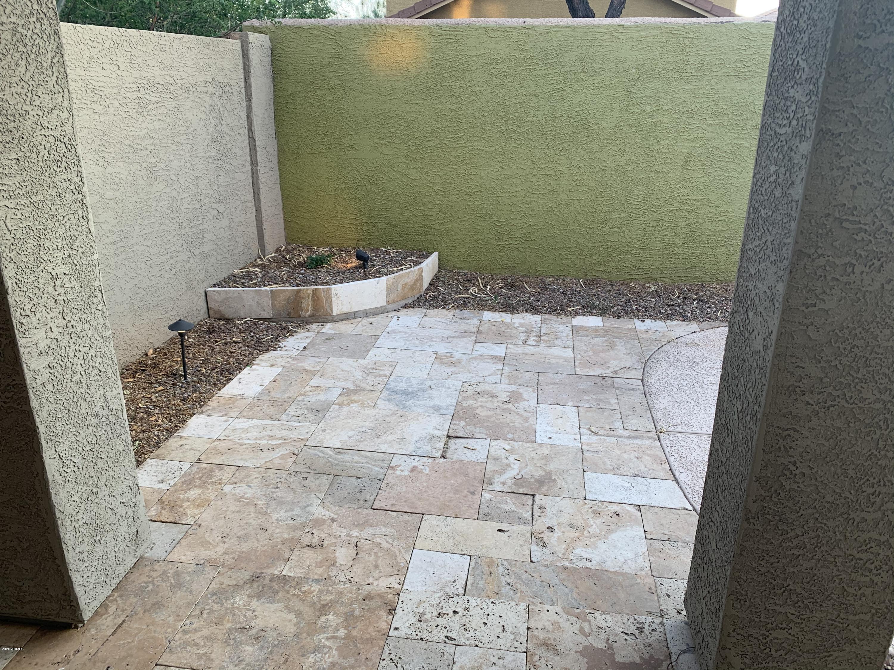 21842 North 40th Place Phoenix, AZ 85050 - Photo 32 of 42 a bathroom with a granite countertop shower and a sink