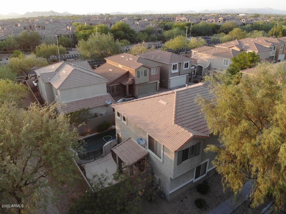 21842 North 40th Place Phoenix, AZ 85050 - Photo 39 of 42 an aerial view of a house with a yard and garage