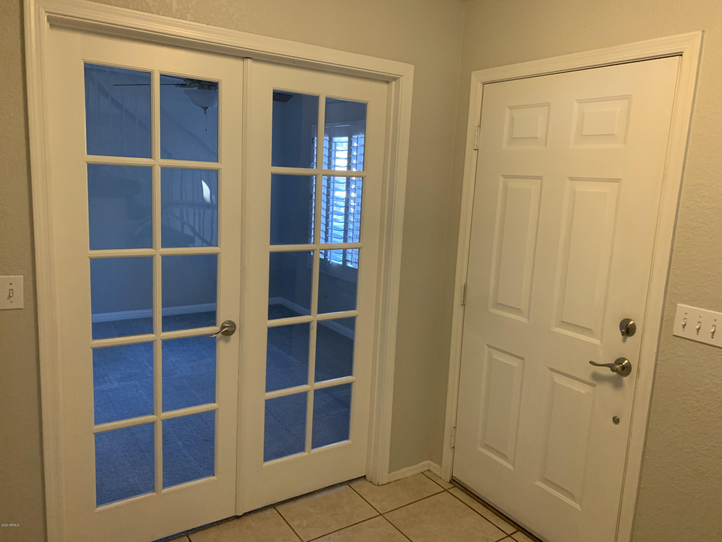 21842 North 40th Place Phoenix, AZ 85050 - Photo 4 of 42 a view of closet area with empty racks