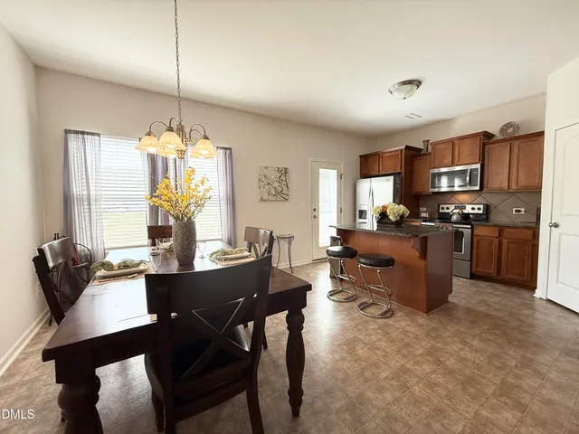 a view of a dining room with furniture