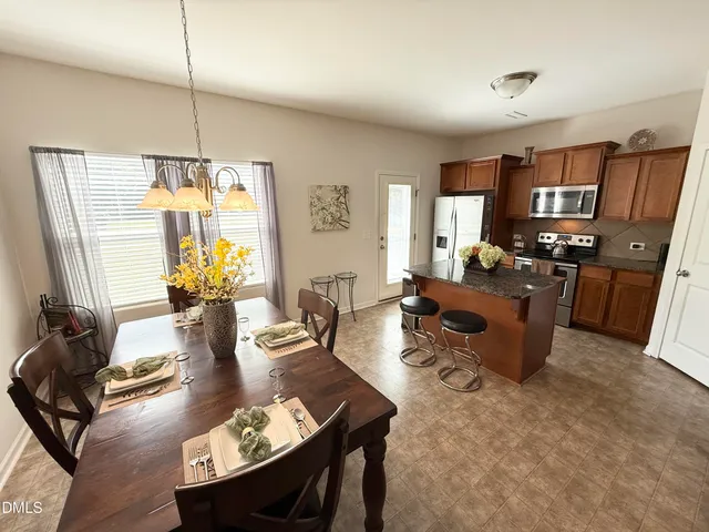 a living room with fireplace furniture and a flat screen tv