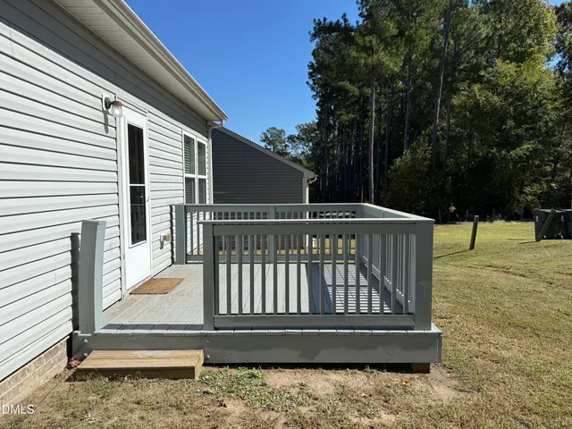 a view of outdoor space with deck having patio