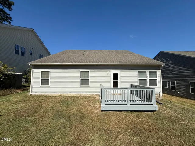 a view of a house with a fence