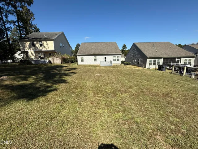 a front view of a house with large garden