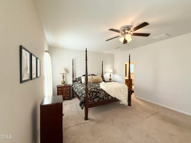 a bedroom with furniture and wooden floor