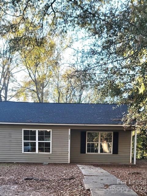 a view of a house with a tree