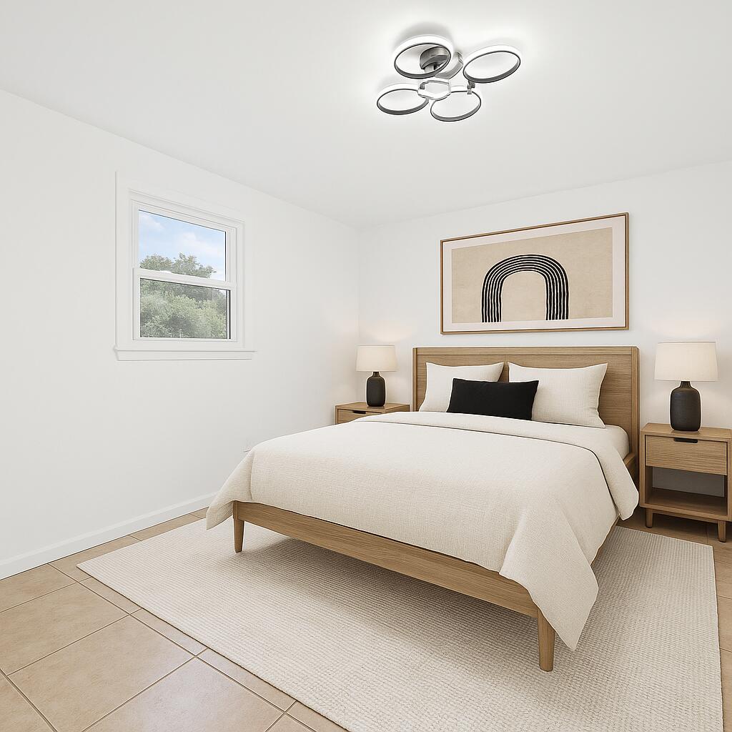 332 B Calhoun Avenue Destin, FL 32541 - Photo 12 of 23 a bedroom with a bed and a painting on the wall
