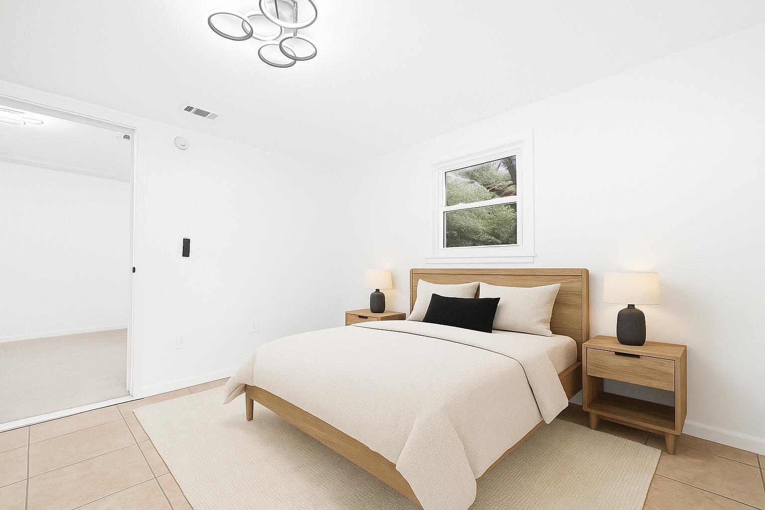 332 B Calhoun Avenue Destin, FL 32541 - Photo 14 of 23 a bedroom with a bed and a window