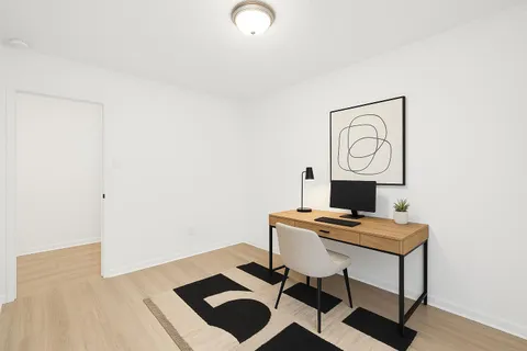 a view of workspace with wooden floor