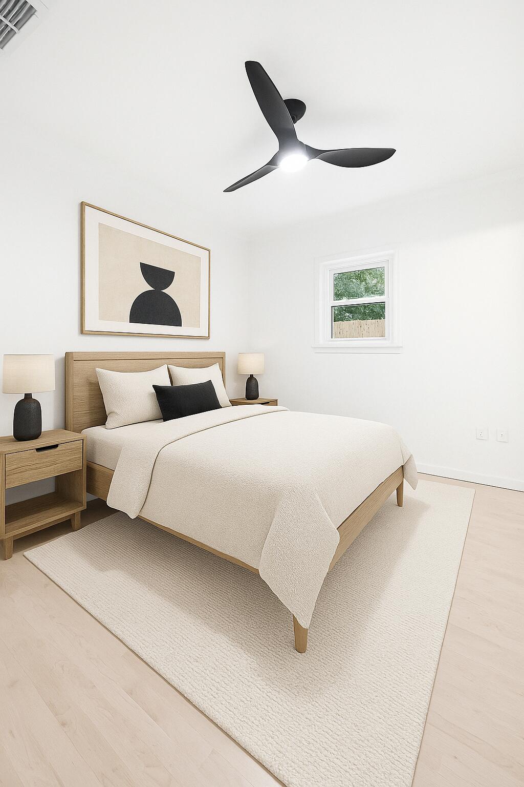 332 B Calhoun Avenue Destin, FL 32541 - Photo 16 of 23 a bedroom with a bed and a painting on the wall