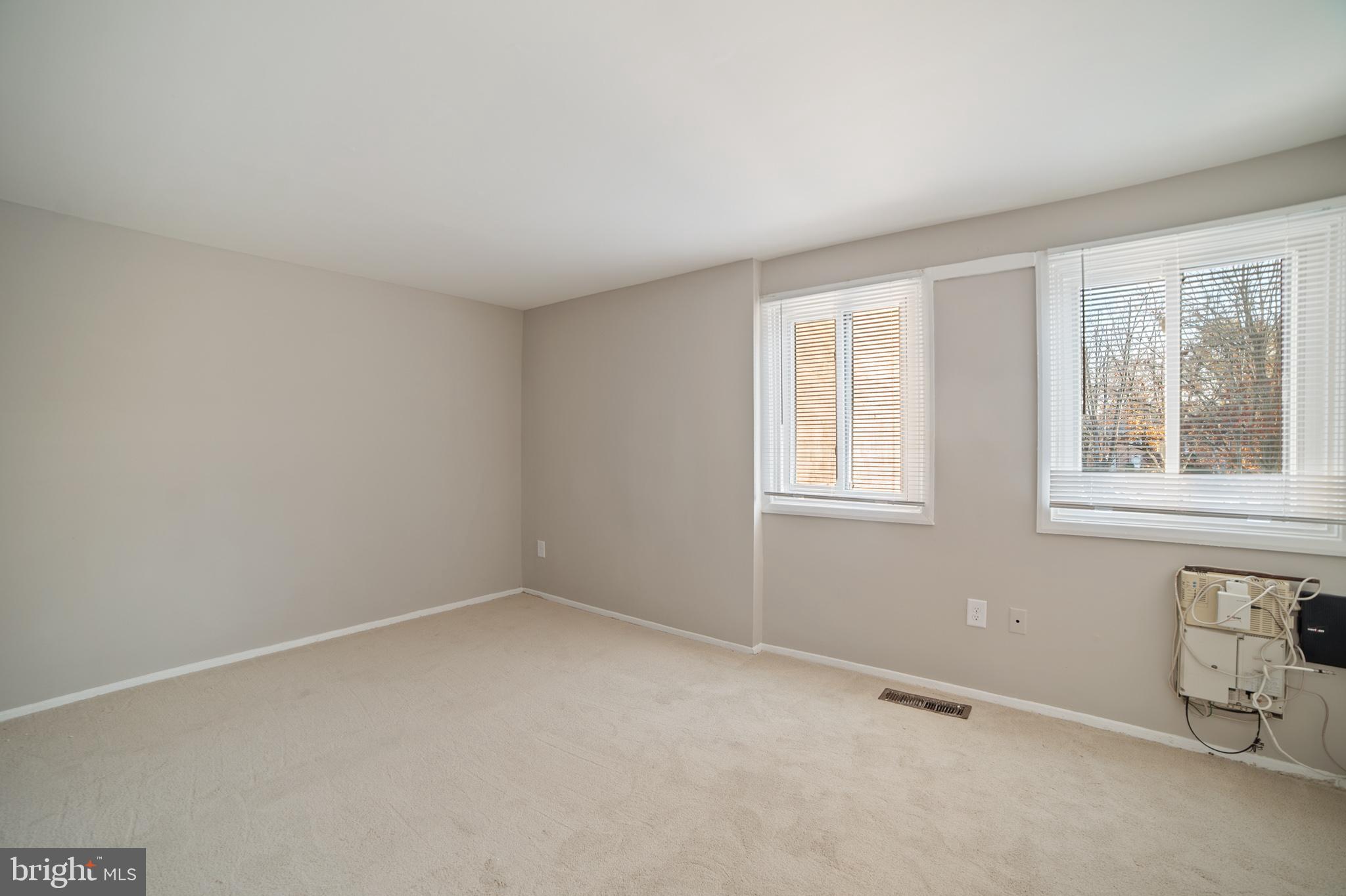 9349 Reader Lane Columbia, MD 21045 - Photo 13 of 32 an empty room with windows
