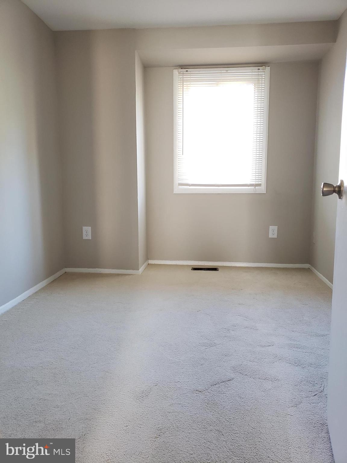 9349 Reader Lane Columbia, MD 21045 - Photo 22 of 32 an empty room with a window