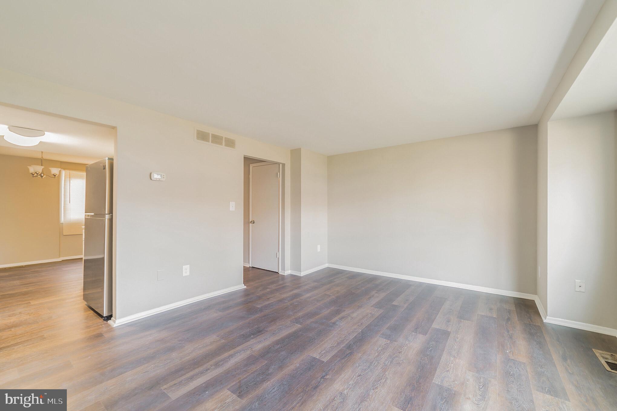 9349 Reader Lane Columbia, MD 21045 - Photo 31 of 32 a view of an empty room and wooden floor