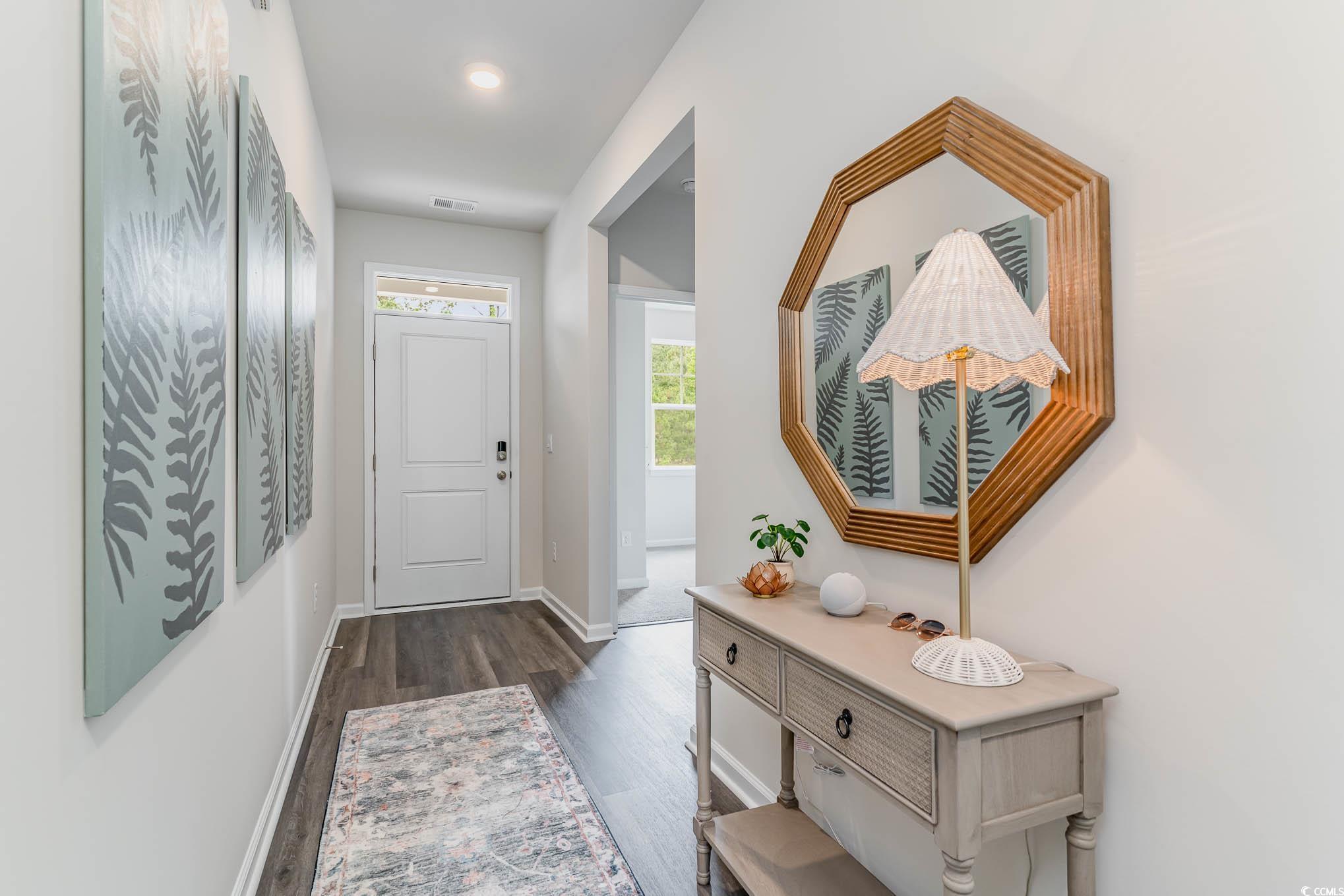 524 Duvall Street Longs, SC 29568 - Photo 2 of 20 Entrance foyer featuring dark wood-type flooring and baseboards