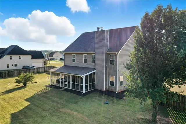 an aerial view of a house with roof deck front of house
