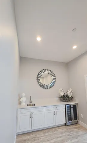 a view of a hallway view with wooden floor and furniture