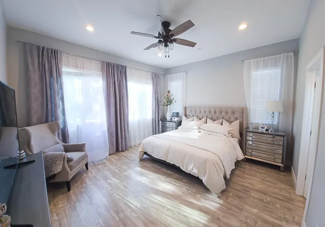 a bathroom with a tub and a window