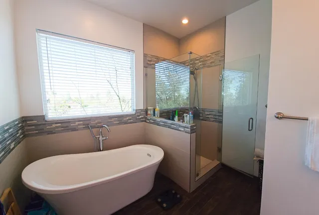 a bathroom with a toilet a sink a vanity and mirror