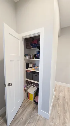 a living room with furniture a window and a chandelier