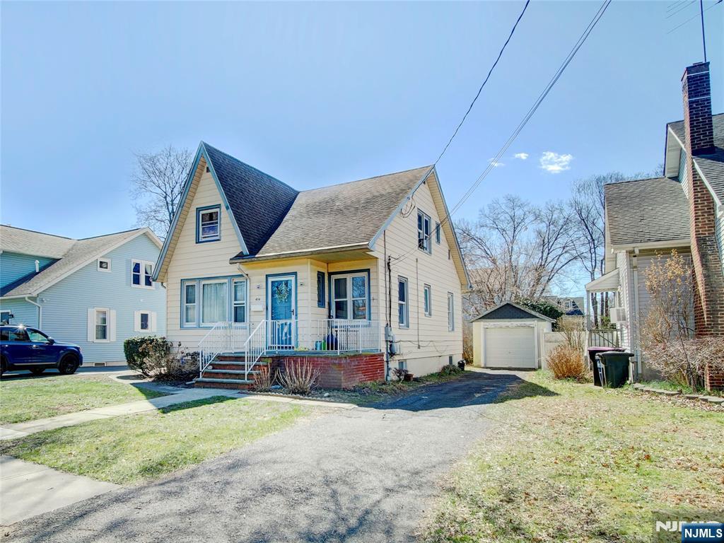 416 Jerusalem Road Scotch Plains, NJ 07076 - Photo 1 of 26 a view of a house with a yard and sitting area