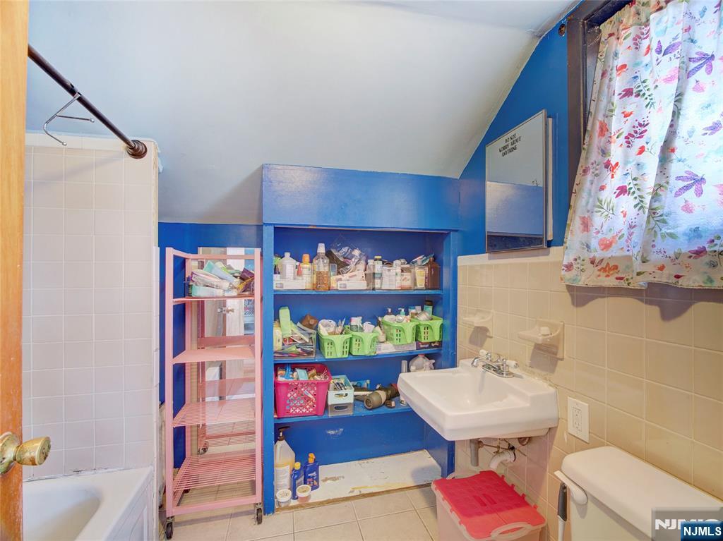 416 Jerusalem Road Scotch Plains, NJ 07076 - Photo 12 of 26 a bathroom with a sink mirror vanity and toilet